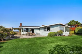 Flat level back yard with grass.