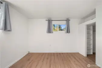 Through the arch to the left you'll find the primary bedroom with a walk in closet!