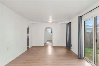 ok back to the main living area looking towards the primary and kitchen is on the left. Great space for a dining room