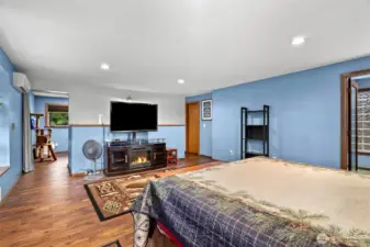 Loft/den attached to the primary bedroom has its own covered deck patio on top