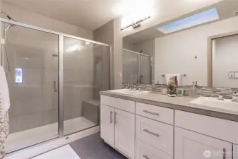 Double sinks, walk-in shower, skylight, and separate water closet!