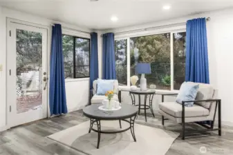 Light and bright family room with a door to the backyard.