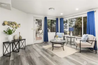 Family room has recessed lighting and durable flooring.