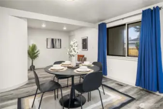 Beyond the dining room is the entrance to the mud room, laundry room, and shop