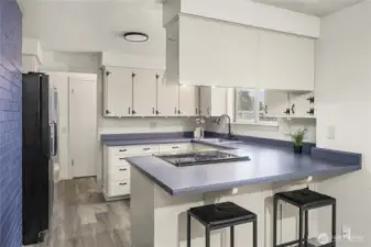 The kitchen has a perfect layout of appliances.