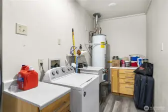 Laundry room is located off the shop area.