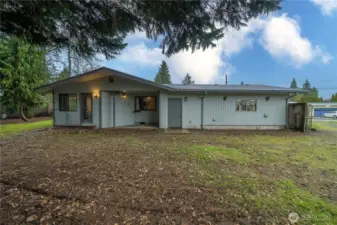 The back of the home has a covered patio.