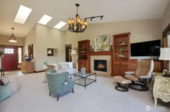 lots of space and light in this living room with propane fireplace