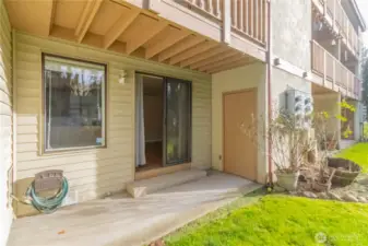 Lovely patio with storage that looks out onto a greenbelt