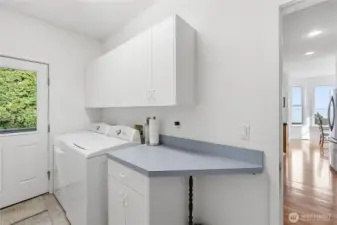 The convenient laundry room is located just off the kitchen. The dog bath station is off camera to the left.  There is also a walk-in pantry + cleaning supplies closet in this room.