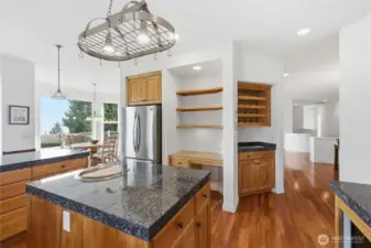 The kitchen also has a built-in desk and wine rack.