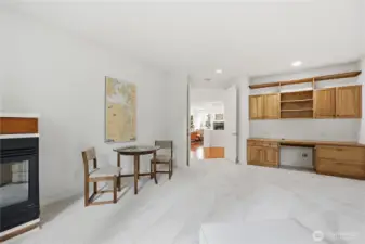 The room features a cozy propane fireplace and built-in desk area.
