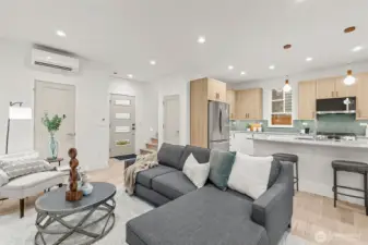 comfortable living room, dining, and kitchen