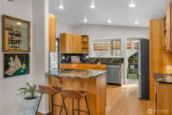 The kitchen features custom hickory cabinetry.