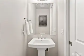 Convenient half bath for guests to use.
