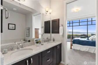 Double vanity in bathroom off primary suite.