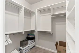 Walk in closet in the primary suite.
