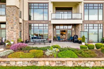 Large outdoor entertaining space gives you enough room to sit by a fire and enjoy a meal with friends and family by the water.