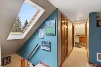 upper bonus room leading to 2 bedrooms