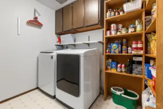 Washer, dryer, and pantry area just off the kitchen.