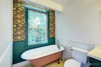 Primary bathroom with claw-foot tub.