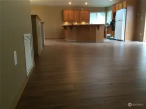 UNIT A Living room looking back at Kitchen and Dining Room to your left.New Black Refrigerator and Dishwasher