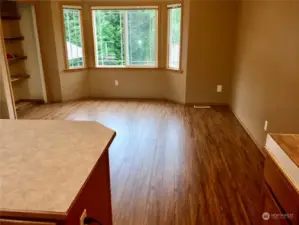 UNIT A looking at dining room and out to Cul-de-sac with bay windows.