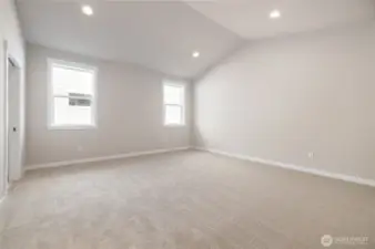 The primary bedroom has vaulted ceilings.