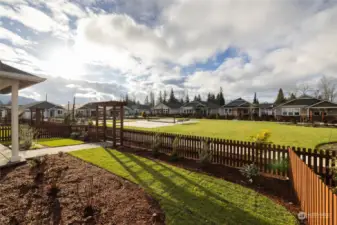 View of the park.  There is a clubhouse w/bocce ball, horseshoe pits and wa lking trail with benches around it.