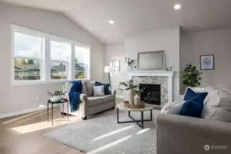 Staged pic of other home. The great room has vaulted ceilings and a gas fireplace.