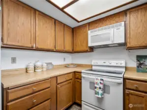 Very functional kitchen with lots of cupboard space.