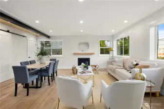 Sunlit family room with shiplap detail and cozy gas fireplace