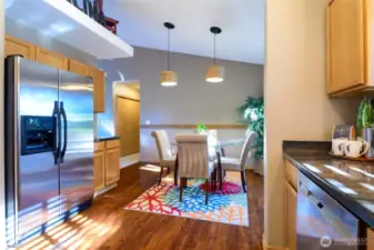 With its warm ambiance and effortless flow, this kitchen and dining area are ready to be the heart of your home.