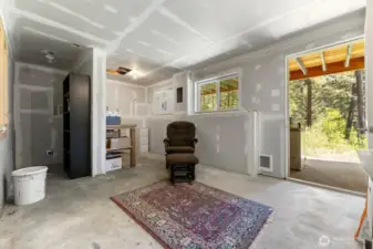 The cool (temperature) basement is perfect for summer projects or even summer sleeping. There is heat if you wish to make it warm in the winter. Hookups for a stackable washer and drier in the rear nook, and a sink plumbed into the front nook. Drain in the floor for easy cleanup.