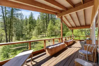 This porch is a delightful place to sit for hours, and is big enough to hold many friends. Hummingbirds also love this porch when feeders are out!