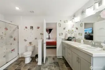 Primary bathroom with walk in shower, double vanity and soaking tub
