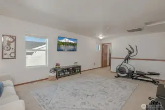 The bonus area offers access to all three bedrooms and the hallway bathroom, with plenty of natural light filling the space—perfect for a variety of uses!