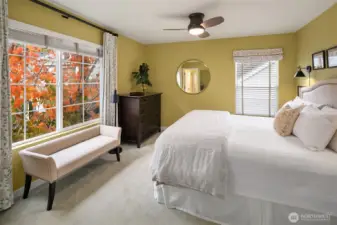 Primary Bedroom with custom blinds and curtains included