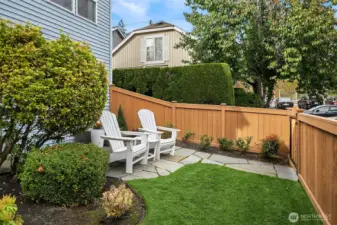 Private partially fenced backyard with direct access to parking spot