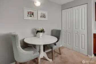 The closet near the kitchen is a utility room for the laundry and hot water heater