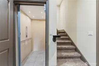 At the basement level, a detailed look at the elevator showcases the lift connecting all three floors