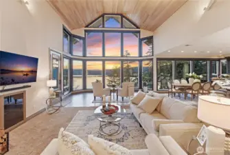 Open great-room layout with the living area centered on the view, and the dining and kitchen areas flowing to the right