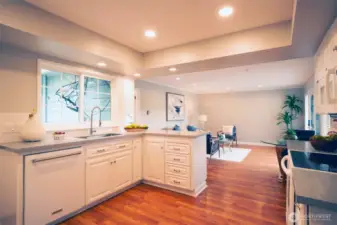 Modern kitchen features new quartz countertops and loads of storage