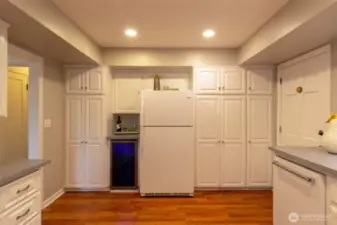 Did we mention the cabinet space! Bright and open and great for entertaining, check out the wine fridge!
