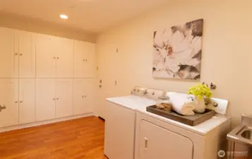 Mudroom over built-in storage, utility sink and additional full bath