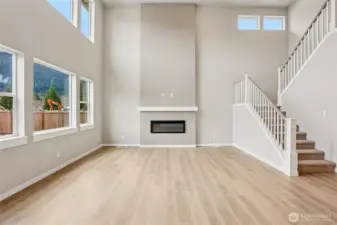 Soaring ceilings in the living room allow for ample light.  Photos are for representation purposes only.  See agent for details.