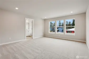 Top floor primary with double doors and large enough to fit a King sized bed.