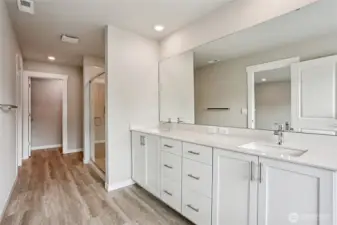 Double sinks, thick quartz slab counters. Photos are for representation purposes only.