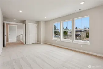 Large upper floor bonus/media room faces South with lots of light!