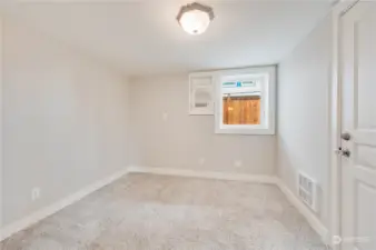 Bedroom basement with an egress window